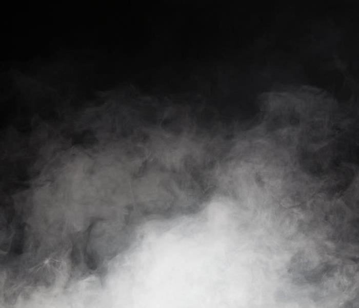 Black room filled with smoke.